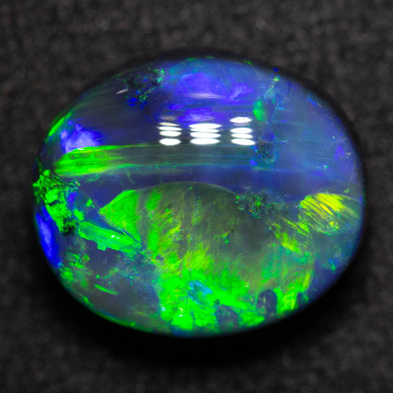 4.42 ct black opal 11.2x9.5x6.4mm