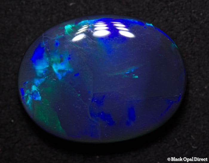 4.45 ct black opal with broad flash 14x11x4mm