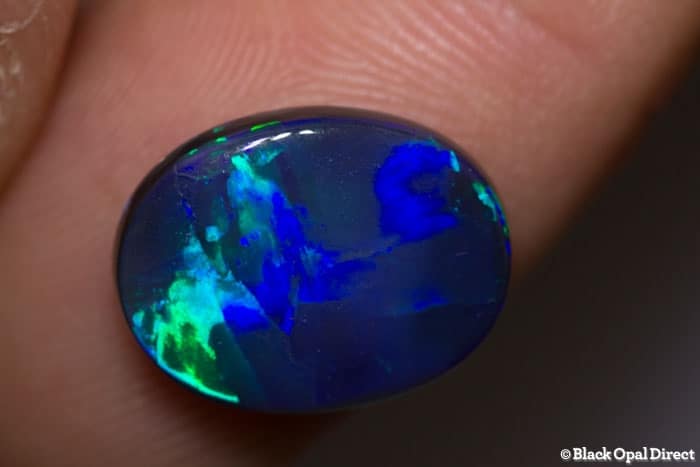 4.45 ct black opal with broad flash 14x11x4mm