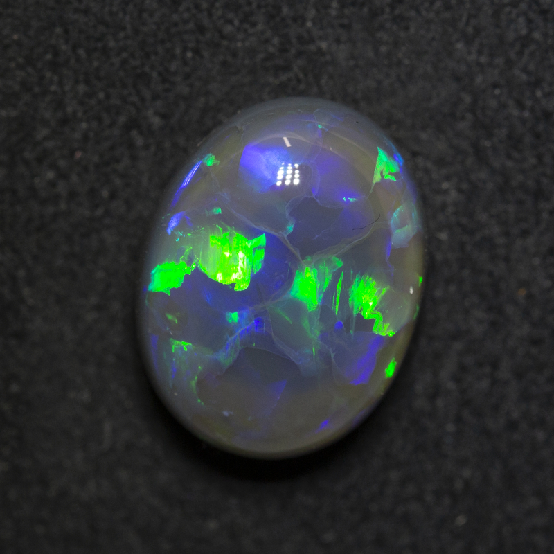 4.56 ct black opal 12.2x9.4x6.4mm