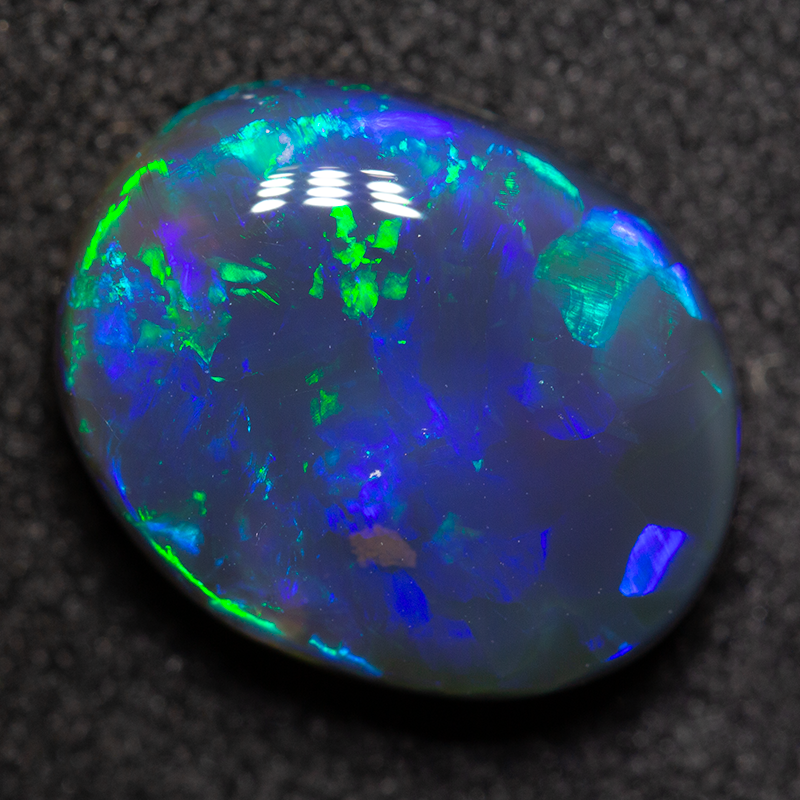 4.77 ct black opal 13x10.4x5.2mm