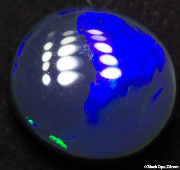 4.84 ct black opal with chinese writing 12.5x11.5x5mm Tim