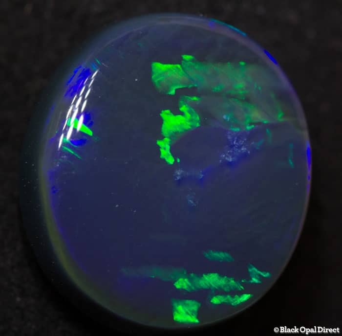 4.84 ct black opal with chinese writing 12.5x11.5x5mm Tim
