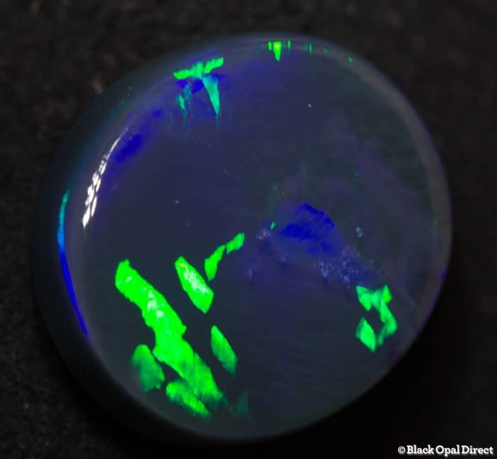 4.84 ct black opal with chinese writing 12.5x11.5x5mm Tim