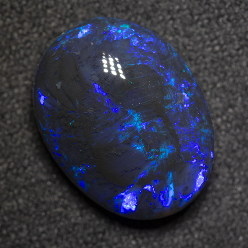 5.24 ct black opal 13.7x10.7x6.2mm