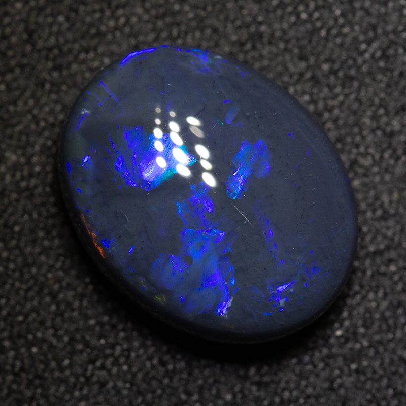 5.95 ct black opal 13.7x10.9x6.1mm