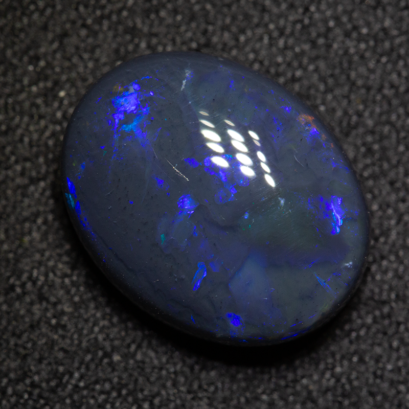 5.95 ct black opal 13.7x10.9x6.1mm