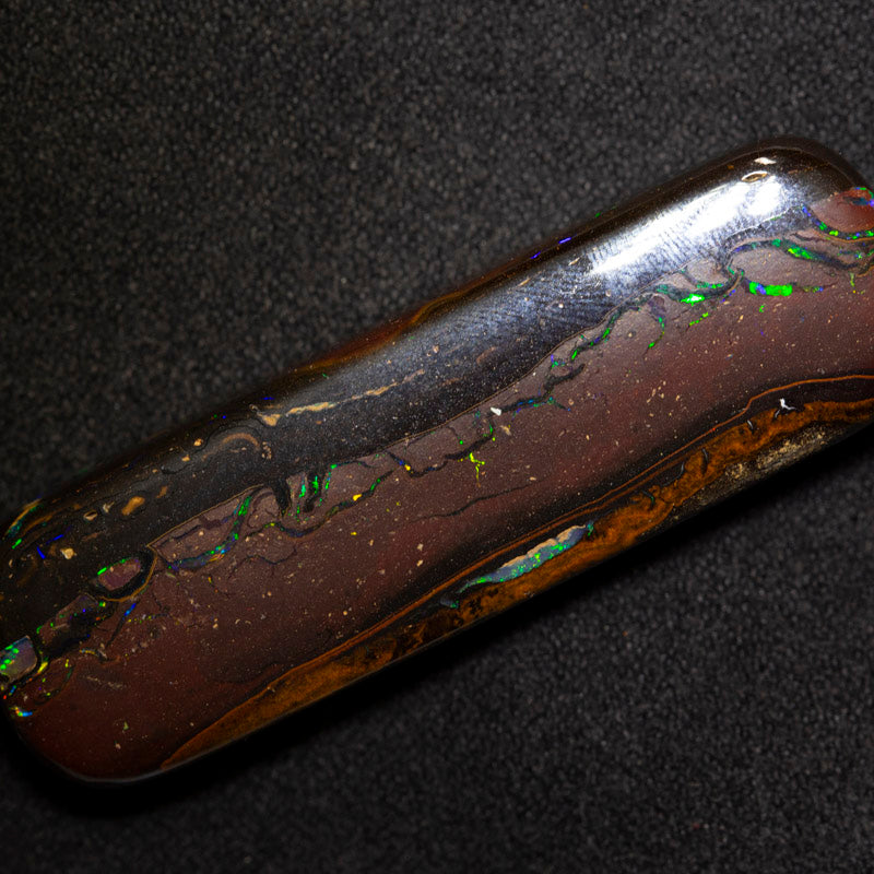 58.73 ct boulder opal 45x13.8x7.4mm
