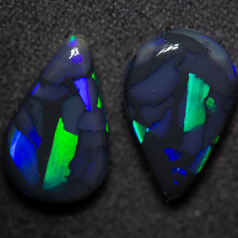 6.95 ct gem black opal pair 14.3x9.5x4.4mm