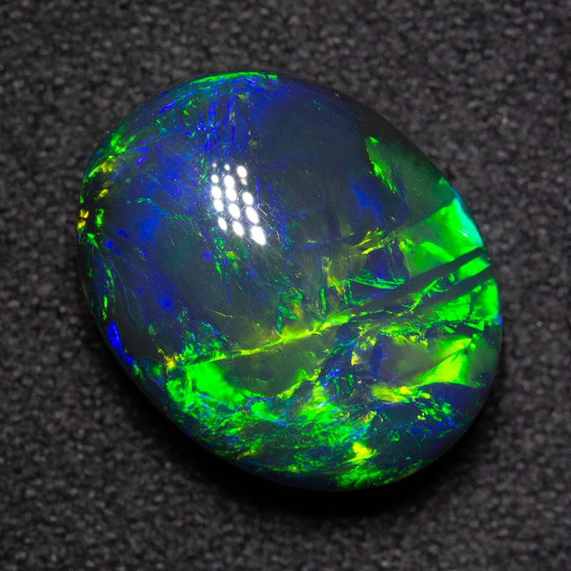 7.55 ct gem black opal 14x11.1x7.4mm