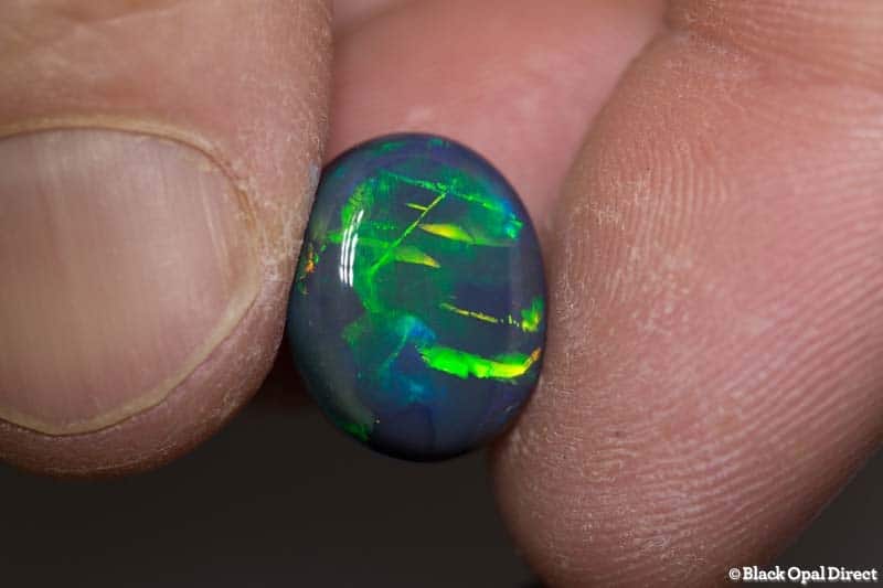 8.79 ct black opal gem with Chinese writing 15x12x7mm