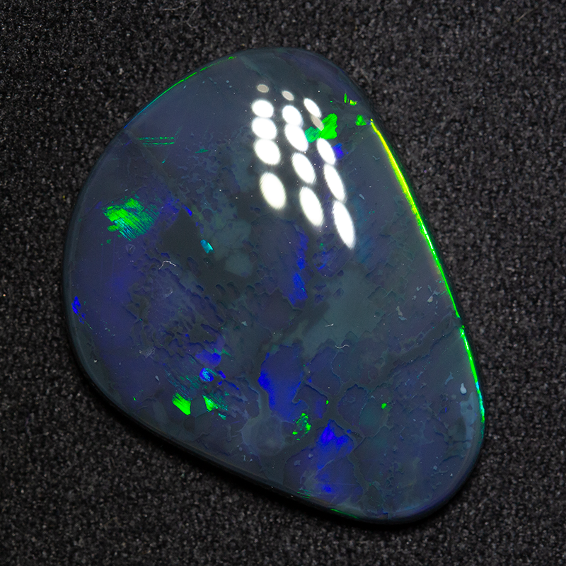 9.31 ct black opal 22.2x16.8x3.6mm