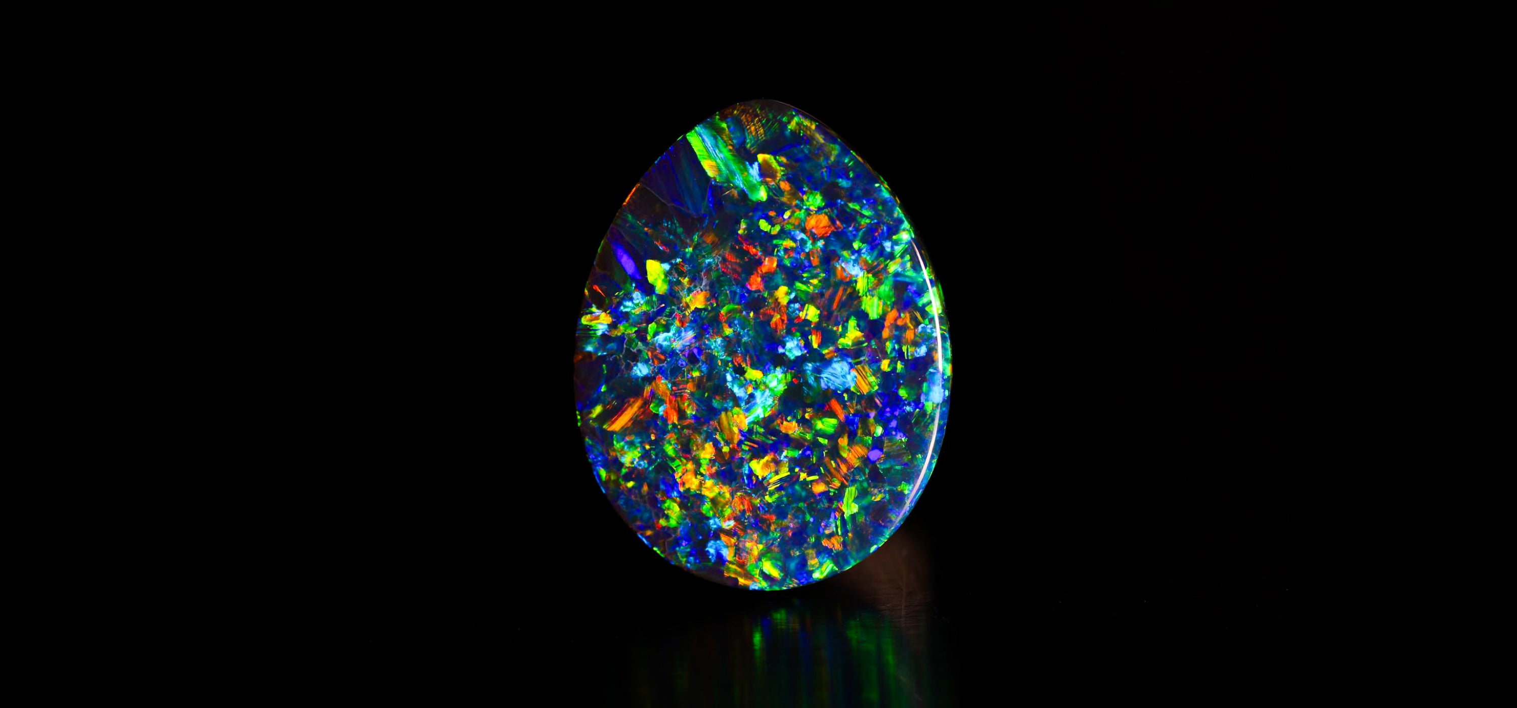 0.74 ct black opal 7x6x3mm