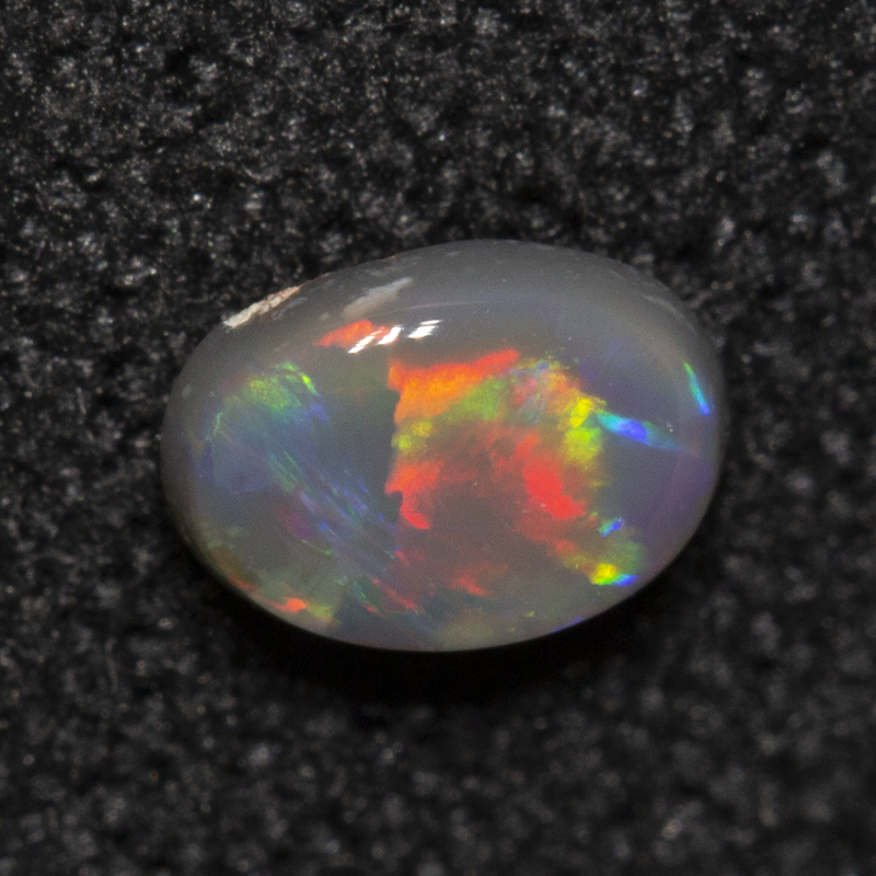 0.23 ct dark opal 4.9x3.6x2mm