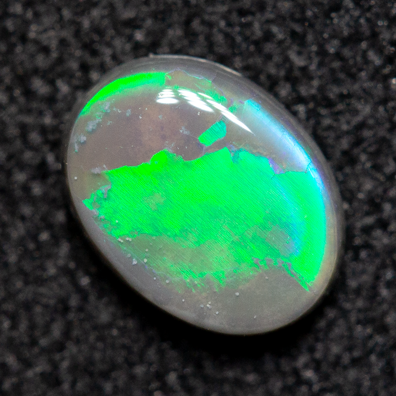 0.35 ct dark opal 5.7x4.4x1.9mm