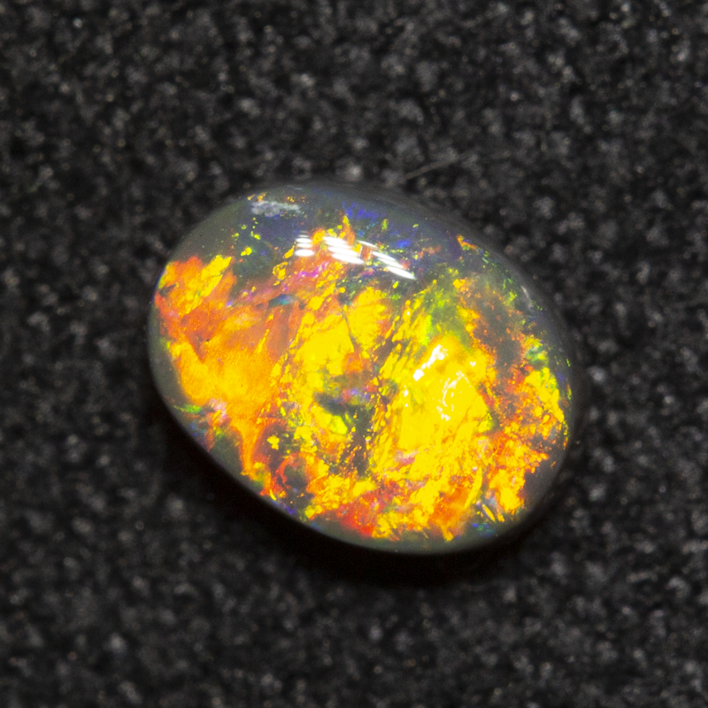 0.37 ct dark opal 5.4x4.1x2.3mm
