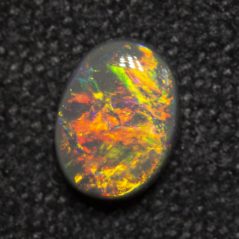 0.37 ct dark opal 5.4x4.1x2.3mm
