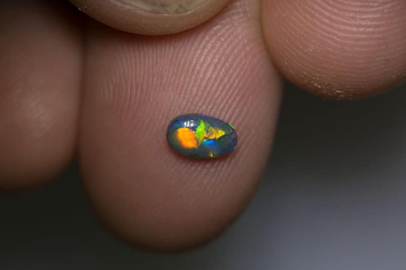 0.37 ct dark opal 6.5x5x2mm