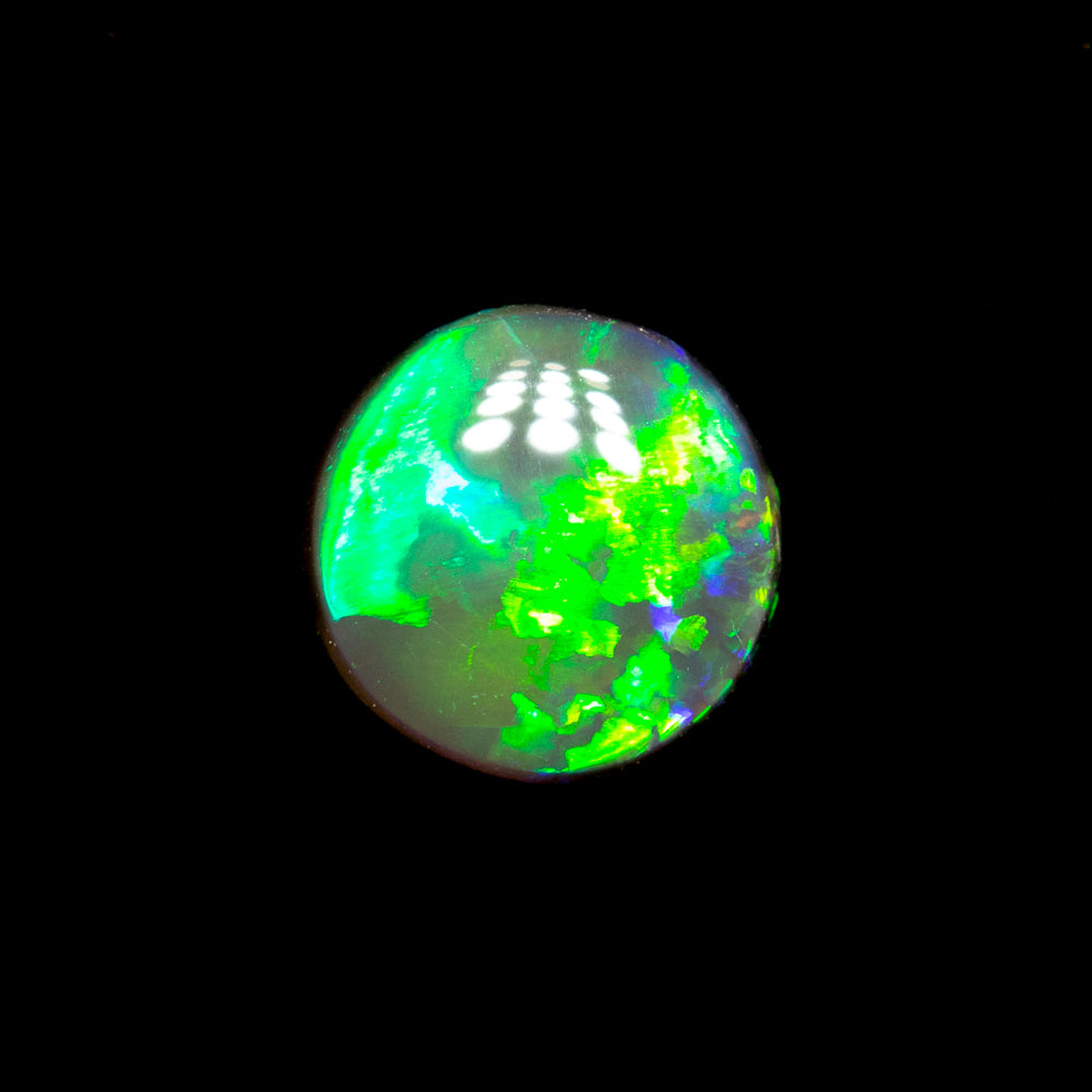 0.38 ct black crystal opal 5.9x5.8x1.7mm