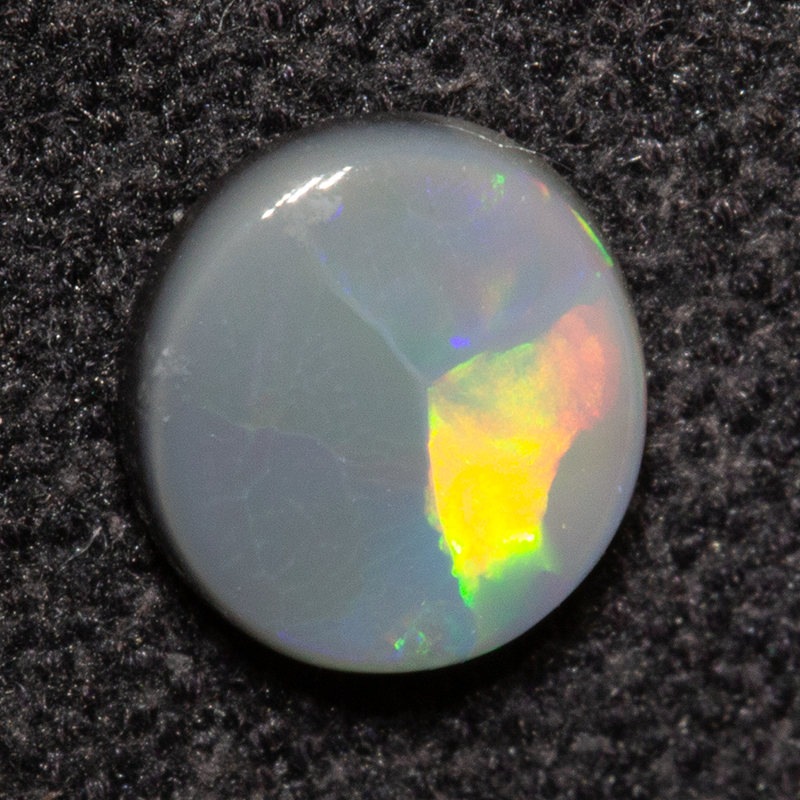 0.39 ct dark opal 5.6x5.2x1.8mm