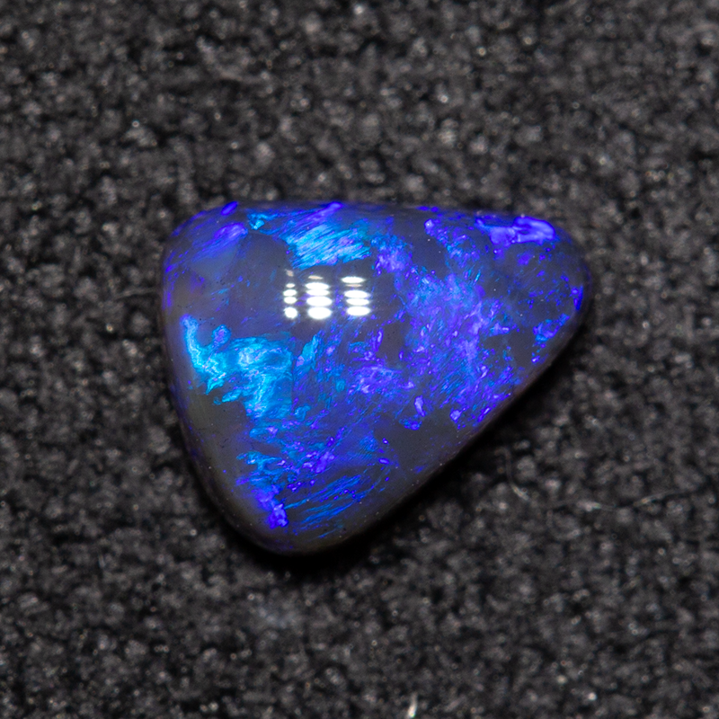 0.39 ct black opal 5.7x4.6x2.4mm