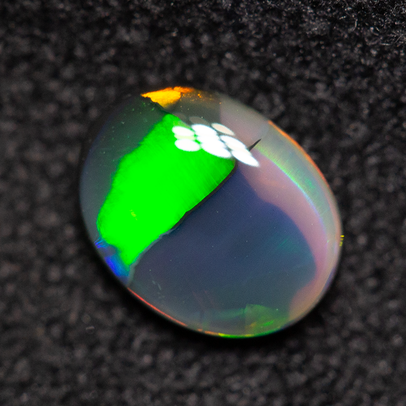 0.39 ct black opal 6.3x4.9x2mm