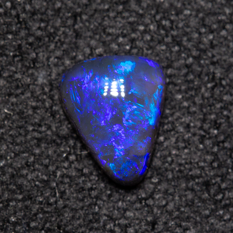 0.39 ct black opal 5.7x4.6x2.4mm