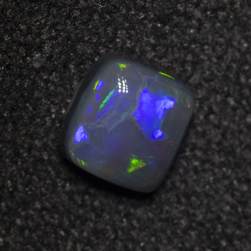 0.43 ct black opal 4.9x4.6x2.4mm