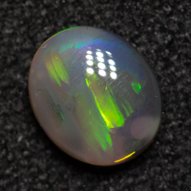 0.46 ct dark opal 5.6x4.8x2.4mm