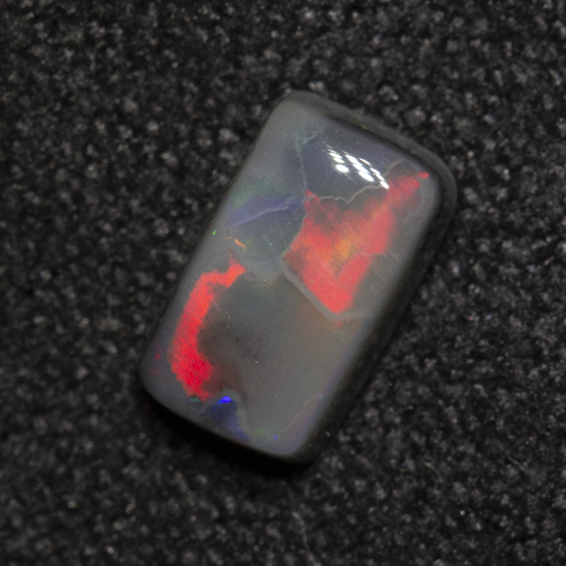 0.49 ct dark opal 6.4x3.9x2.3mm