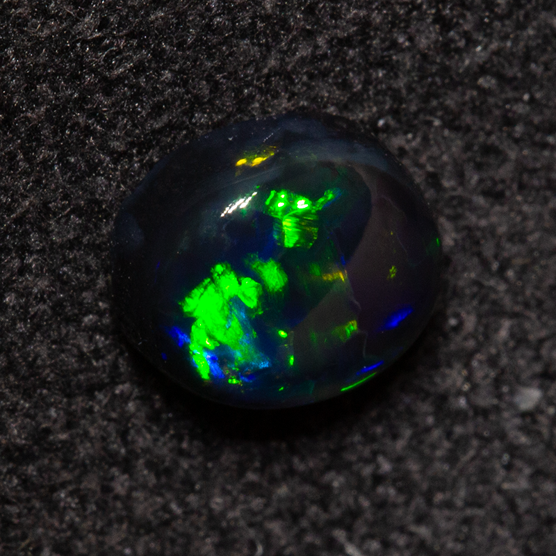 0.49 ct black opal 4.7x5.4x2.6mm