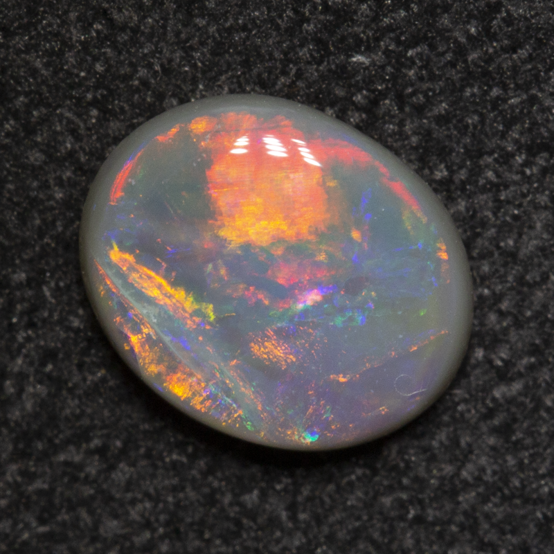 0.50 ct dark opal 6.7x5.4x1.9mm
