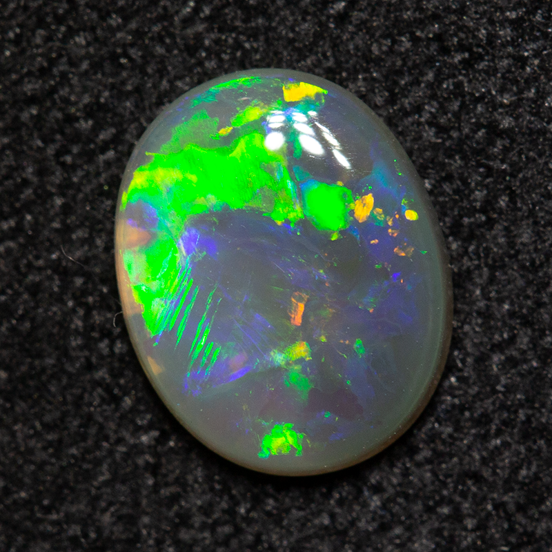 0.51 ct dark opal 7.2x5.8x1.8mm
