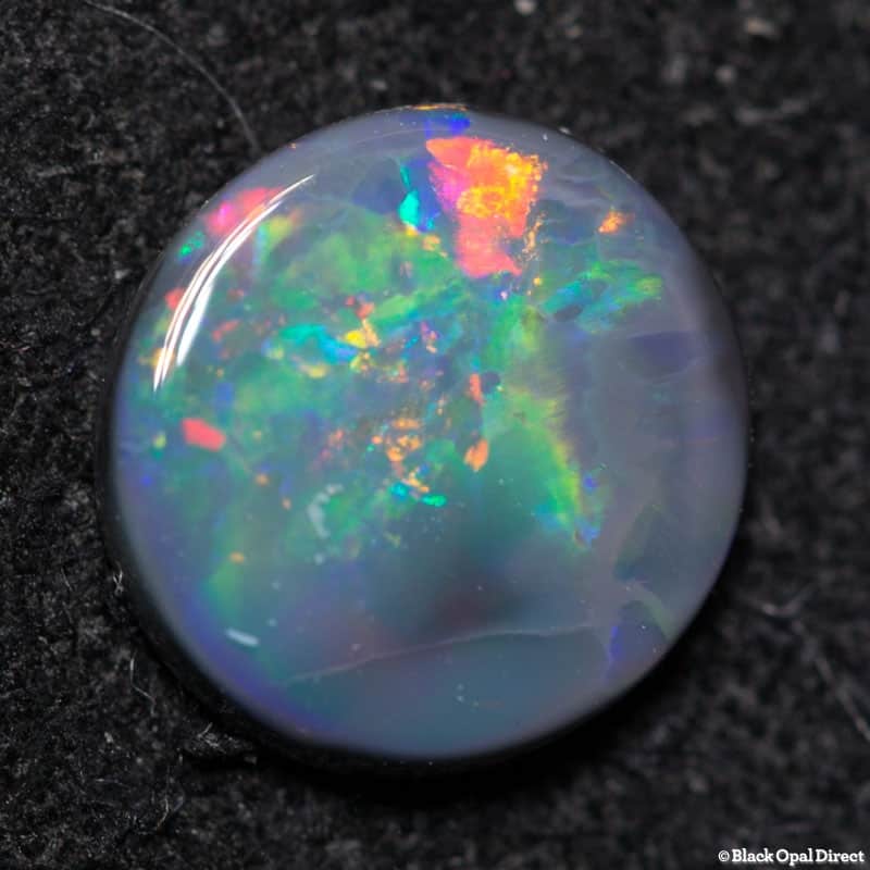 0.52 ct black opal 6mm round x 1.5mm