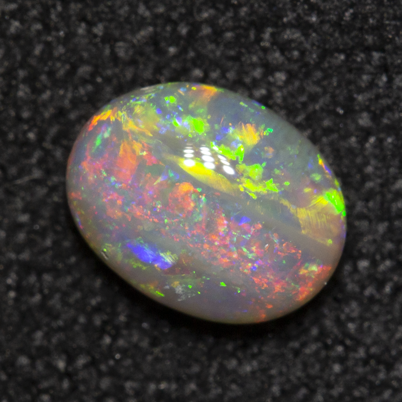 0.53 ct dark opal 6.1x4.7x2.7mm