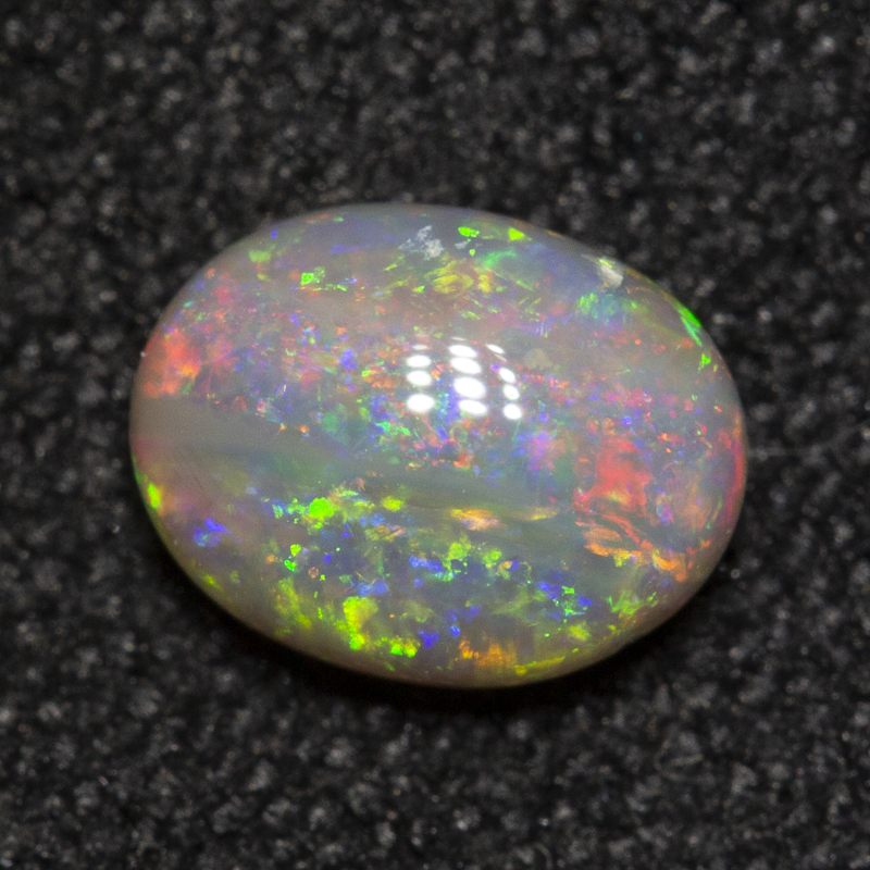 0.53 ct dark opal 6.1x4.7x2.7mm