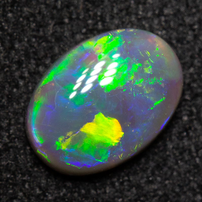 0.54 ct dark opal 7x5.1x2.2mm