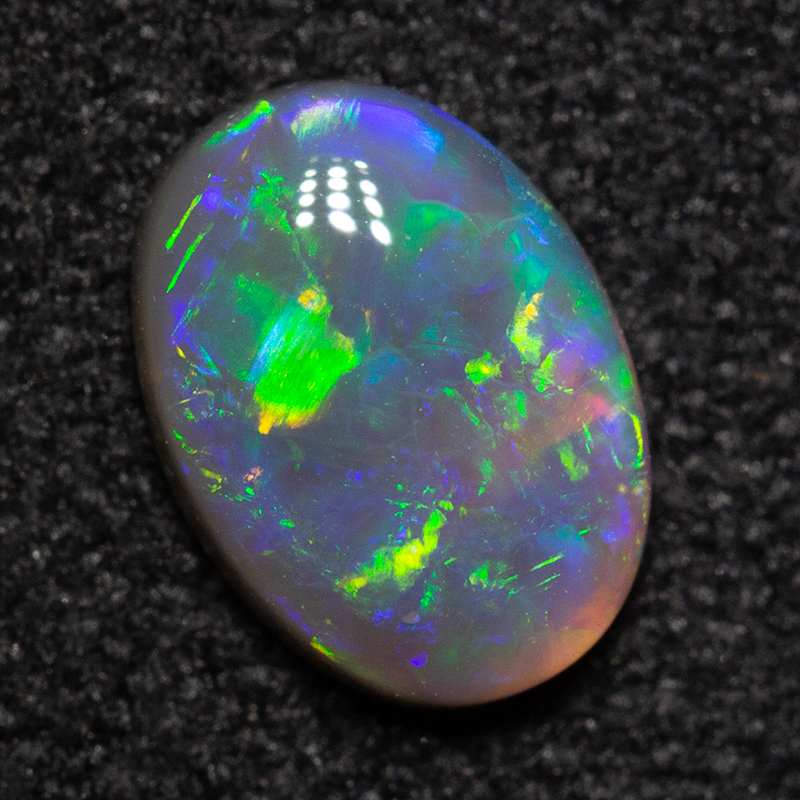 0.54 ct dark opal 7x5.1x2.2mm