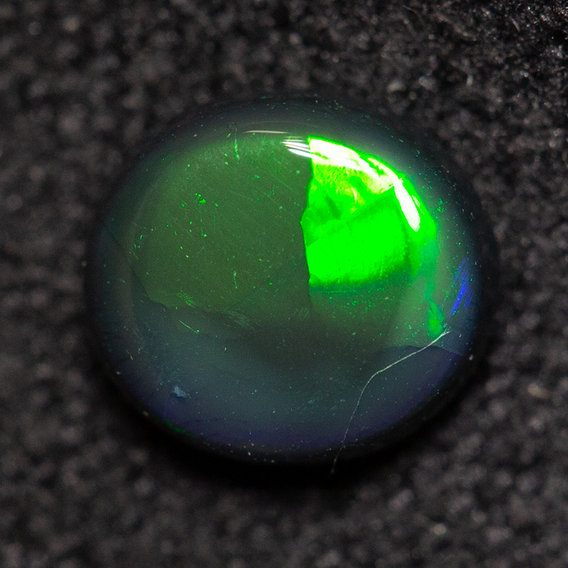 0.55 ct black opal 5.9x5.3x2.5mm