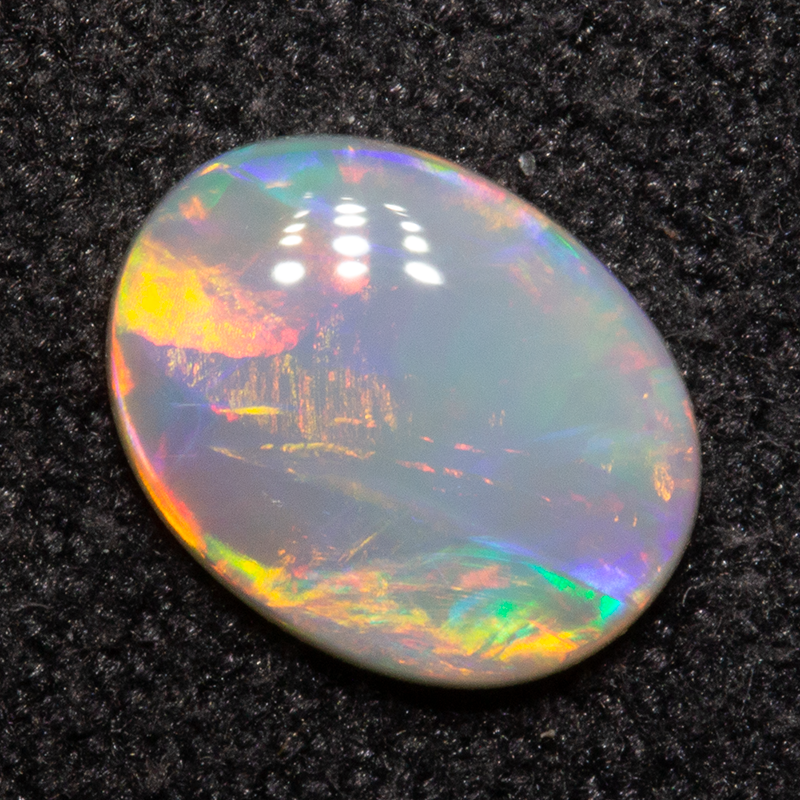 0.55 ct dark opal 7.2x5.6x1.9mm