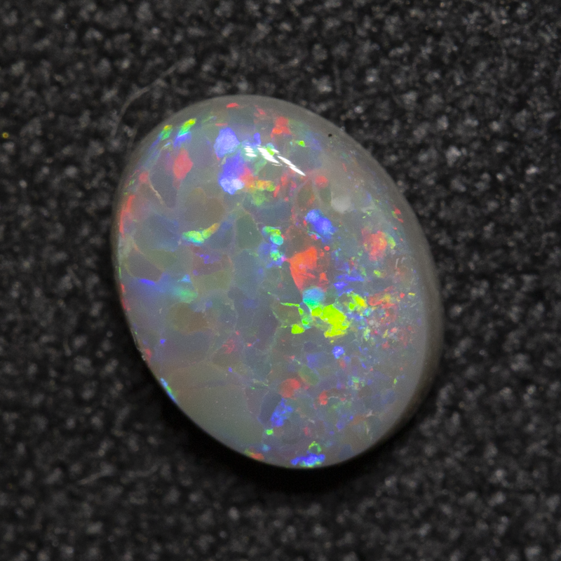 0.56 ct dark opal 6.5x5.1x2.4mm