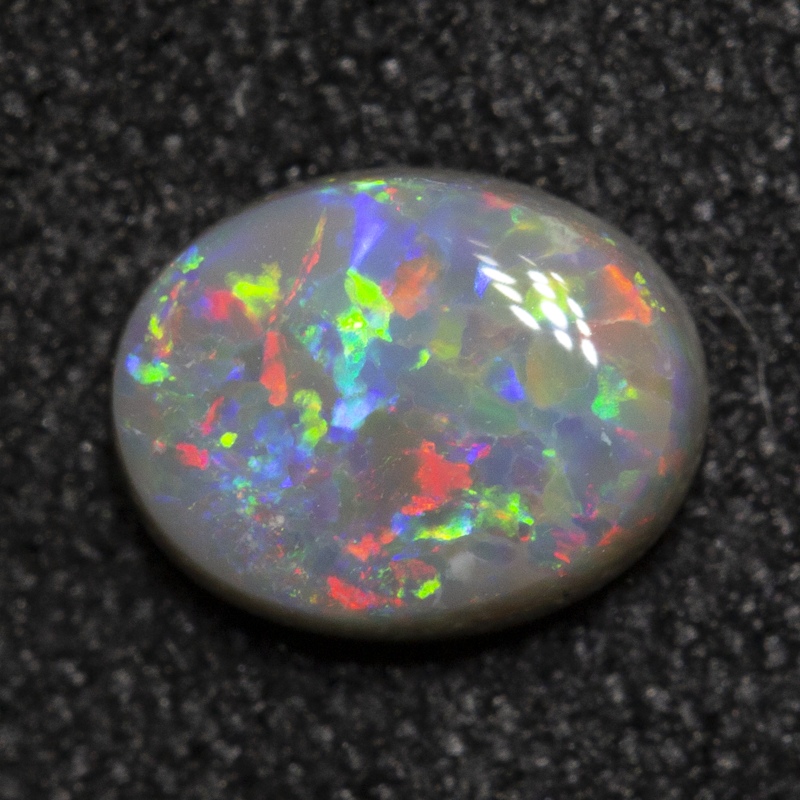 0.56 ct dark opal 6.5x5.1x2.4mm