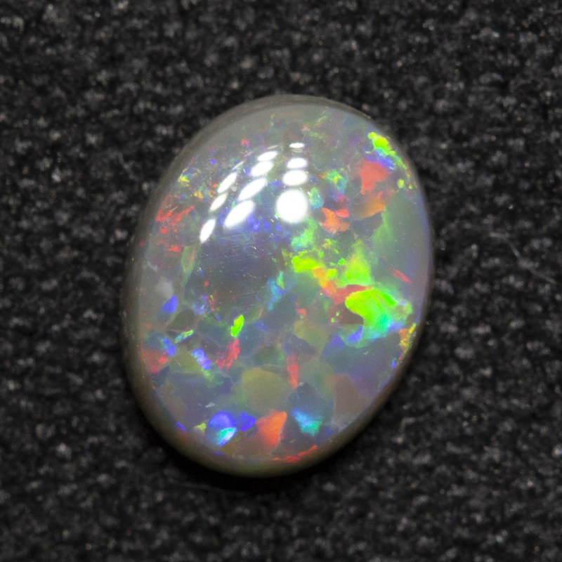 0.56 ct dark opal 6.5x5.1x2.4mm