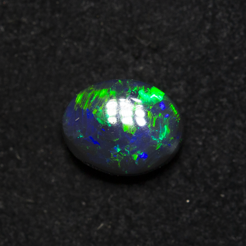 0.57 ct black opal 5.9x4.6x3mm