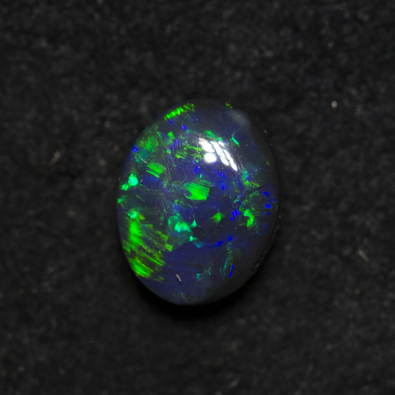 0.57 ct black opal 5.9x4.6x3mm