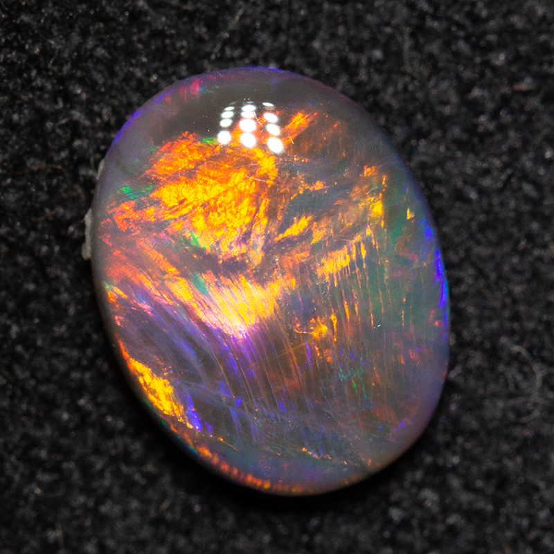 0.58 ct black opal 7.1x5.6x2.4mm