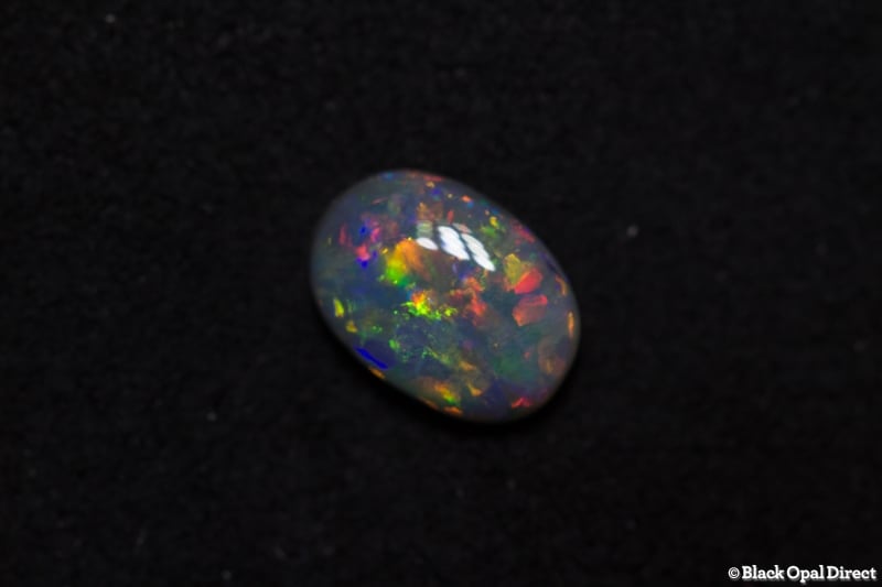 0.58 ct semi black opal 7x5x2mm