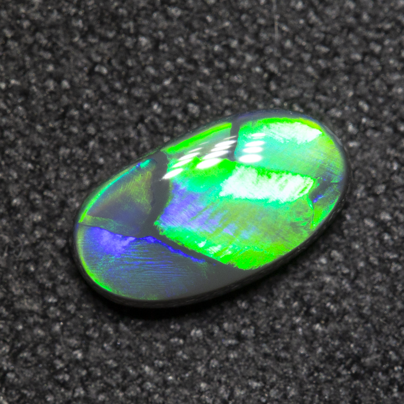 0.59 ct black opal 7.8x4.4x2.6mm