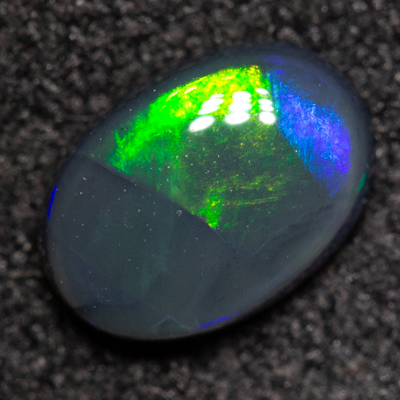 0.60 ct black opal 6.8x4.8x2.6mm