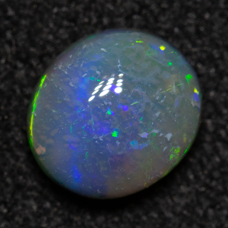 0.60 ct dark opal 6.1x5.4x3mm